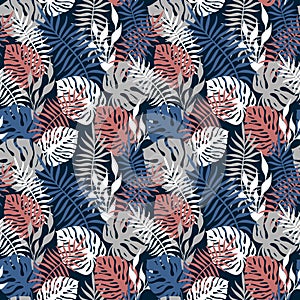 BLUE BACKGROUND WITH PALM AND MONSTERA LEAVES