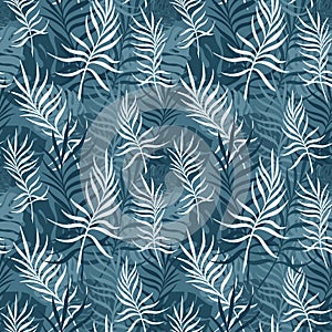 BLUE BACKGROUND WITH PALM AND MONSTERA LEAVES