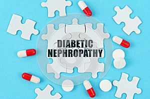 On a blue background, pills, capsules and puzzles with the inscription - Diabetic nephropathy