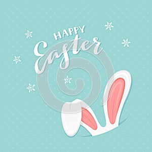 Blue background with rabbit ears and text Happy Easter