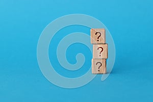On blue background, there is pyramid of cubes with question mark