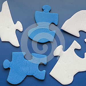 Blue background with two-color puzzle pieces