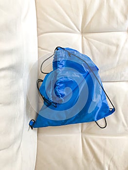 Blue Backpack in a white couch