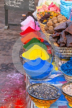 Blue bags with aromatic herbs and colored dyes in the Marrakech market