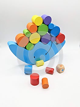 Blue balance toy with colored cilinders