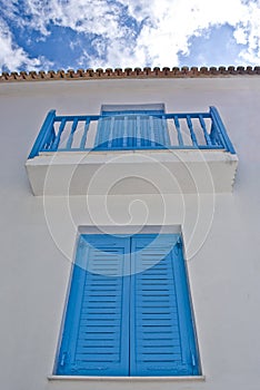 Blue balcony in streets of Skiathos island in Gree