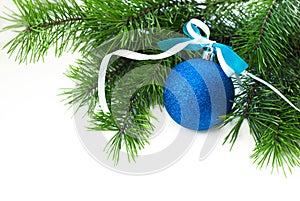 Blue ball with ribbon and Christmas-tree branch