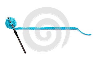 A blue ball of yarn with crochet needle