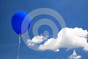 Blue baloon flying in the sky photo