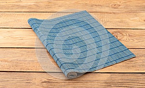 Blue bamboo food mat on a wooden background