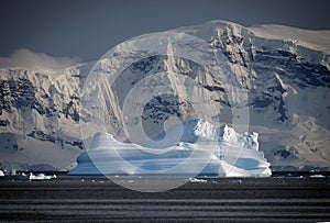 Blue ice berg in Paradise Bay, Antarctic Peninsula photo