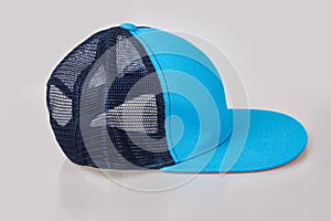Blue baseball cap or trucker hat with black mesh