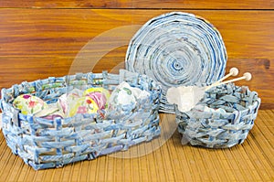 Blue basket full of handcolored Easter Eggs in decoupage