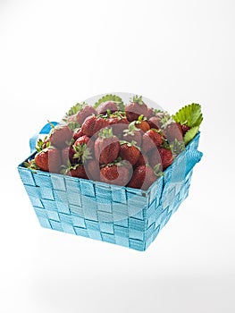 A blue basket of strawberry