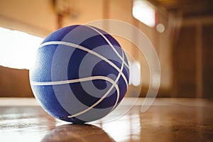 Blue basketball on hardwood floor