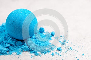 Blue bath bomb on white tabletop