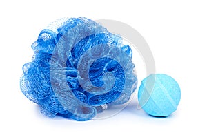 Blue bath sponge and aroma bomb isolated on white background