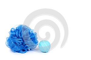 Blue bath sponge and aroma bomb isolated on white background, copy space template