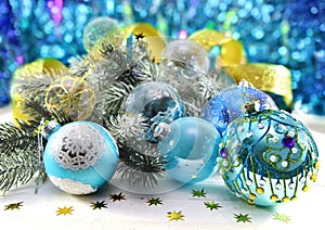 Blue baubles with conifer and golden lace