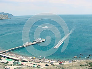 Blue bay with berth for yachts and boats.