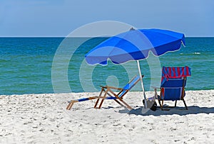 Blue Beach Chairs with Umbrella on Gulf Shores Beach