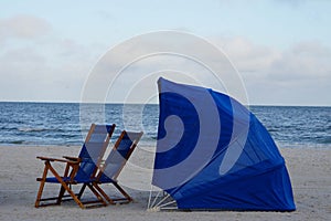 Clearwater Beach Florida Blue beach chairs and umbrella on white sand beach