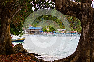 Blue beach of Sapzurro town from a view framed by trees. Colombia, ChocÃÂ³ photo
