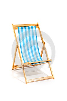 Blue beach sunbed isolated on white photo