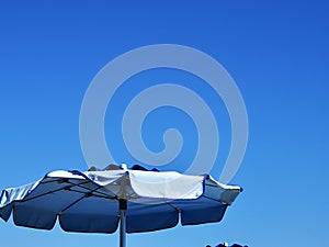 Blue beach umbrellas photo