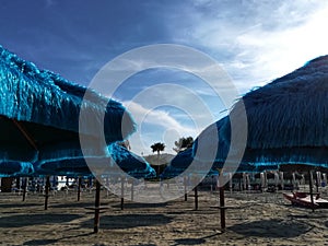 Blue beach umbrellas