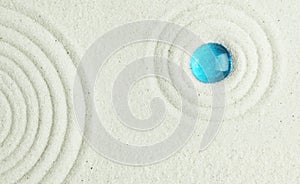 Blue bead in the sand