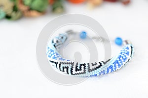 Blue beaded bracelet with greek ornament