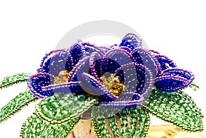 Blue beads flower with green leafs