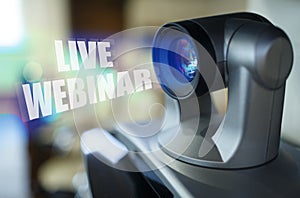 A blue beam glows from the projector inside which is the inscription - Live Webinar