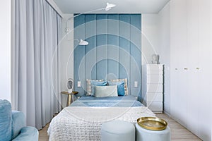 Blue bedroom with upholstered wall