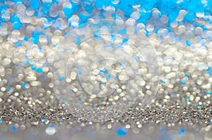 Blue,beige,grey,or silver white abstract light background, shining lights, sparkling glittering Christmas lights. Blurred abstract