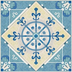 A blue and beige tile with a geometric floral pattern