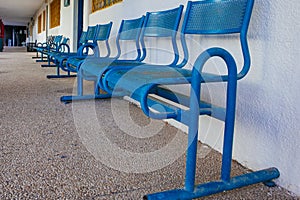Blue bench in school yard