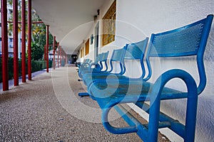 Blue bench in school yard