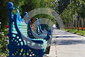 blue benches in the park at the presidential palace in Dushanbe