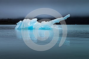 Blue Ice Berg on Lake in Alaska photo