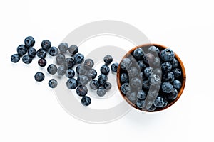 Blue berries in a wooden cup. Top View