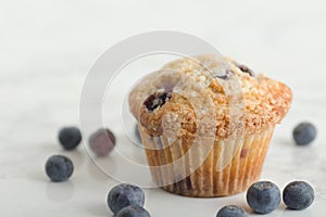 Blue Berry Muffin On White Marble Counter top With Fresh Blueberries