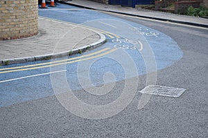 Blue bicycle lane on a corner turn