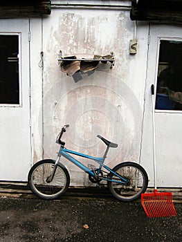 Blue bicycle and wall