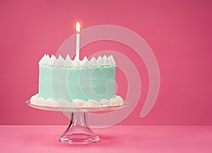 Blue Birthday Cake over pink Background.