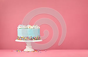 Blue Birthday Cake on Pink Background