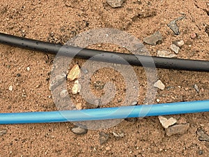 Blue and black cable. Building of lines of metallic and fiber optic cables,