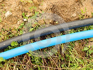 Blue and black cable. Building of lines of metallic and fiber optic cables, internet connection.