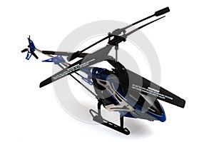 A blue black toy helicopter chopper with two pairs of separate rotor blades